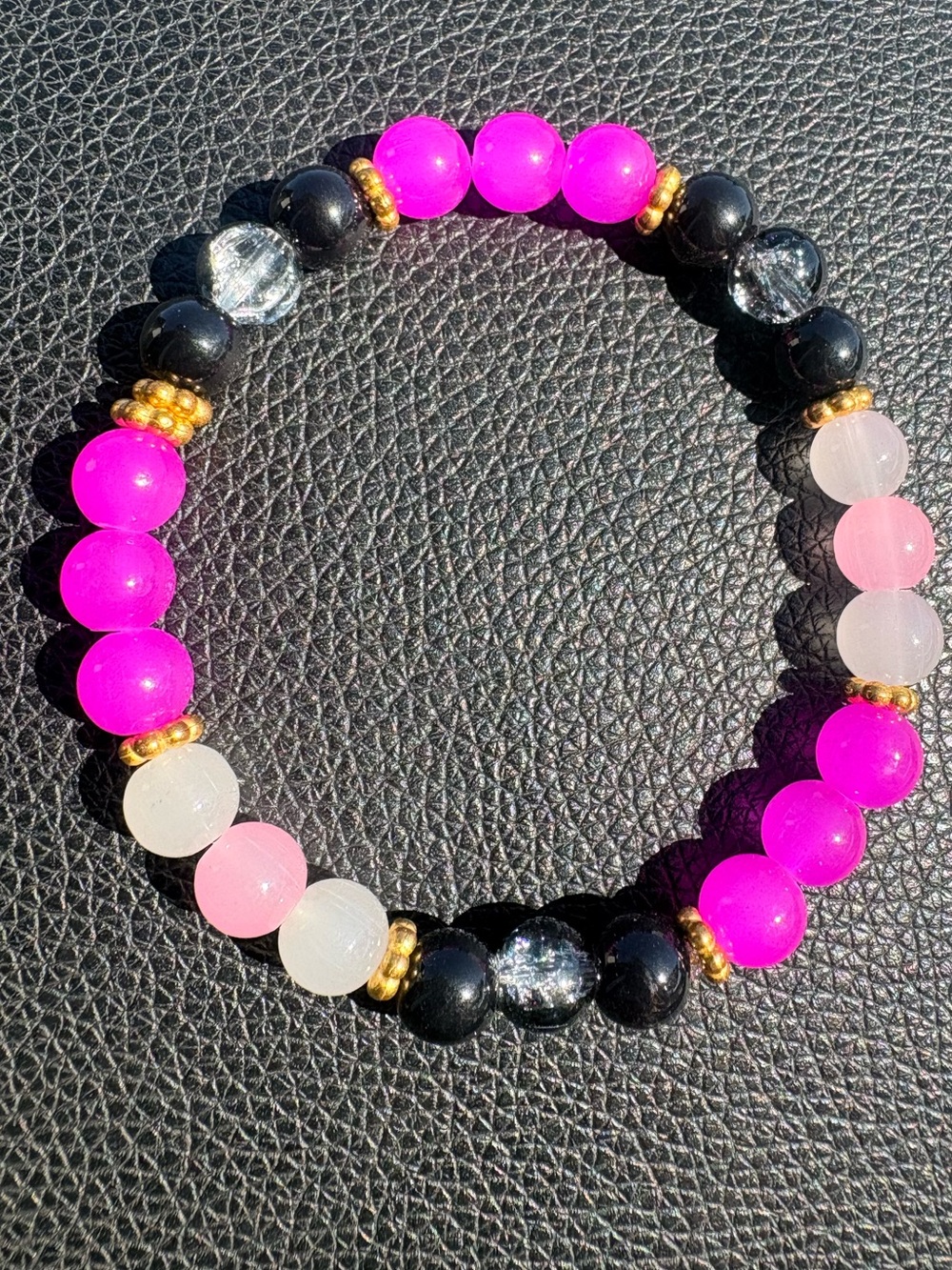Pink, Black, and White Glass beaded Bracelet with gold accent